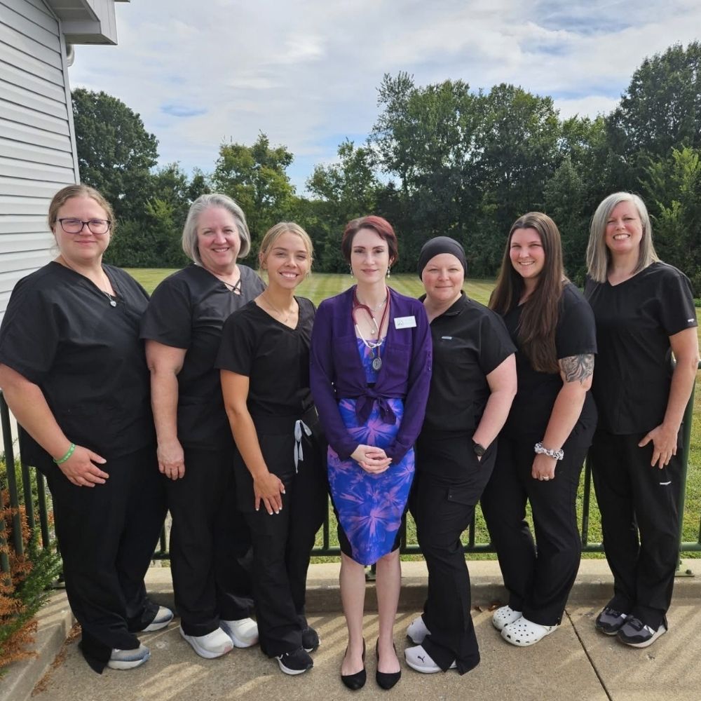 lady petting dog at the animal hospital